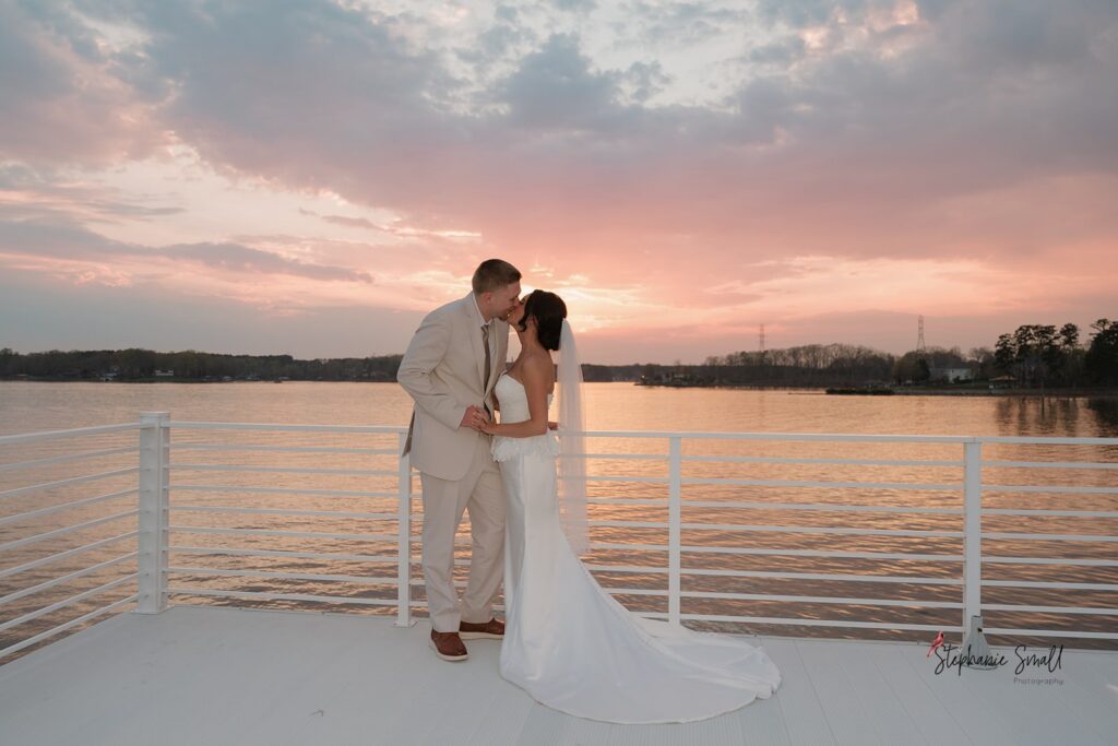 Sunset boat portraits from lakeside wedding North Carolina