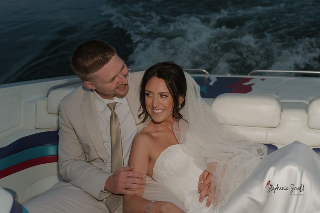 Sunset boat portraits from lakeside wedding North Carolina