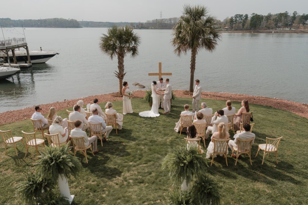 Waterfront ceremony setup for lakeside wedding North Carolina