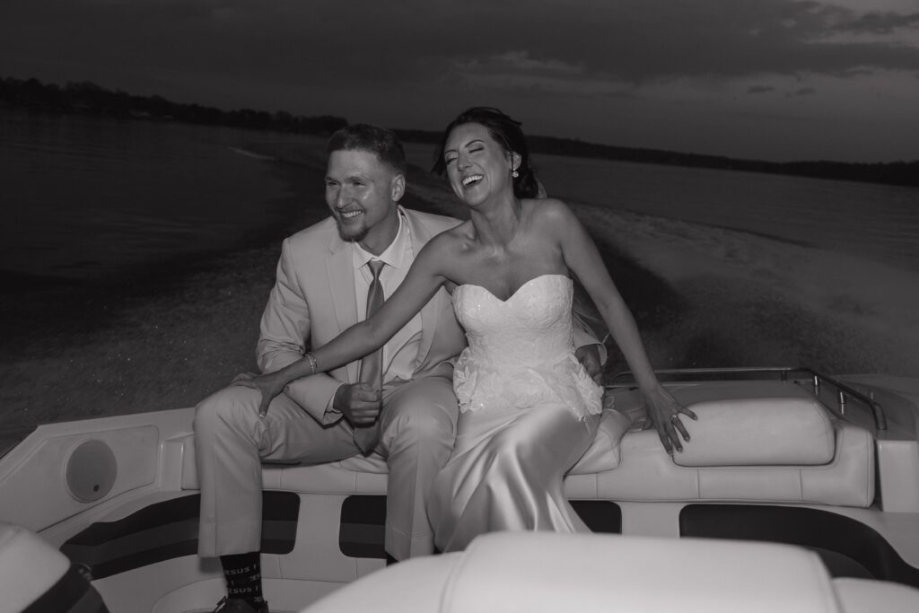 Sunset boat portraits from lakeside wedding North Carolina