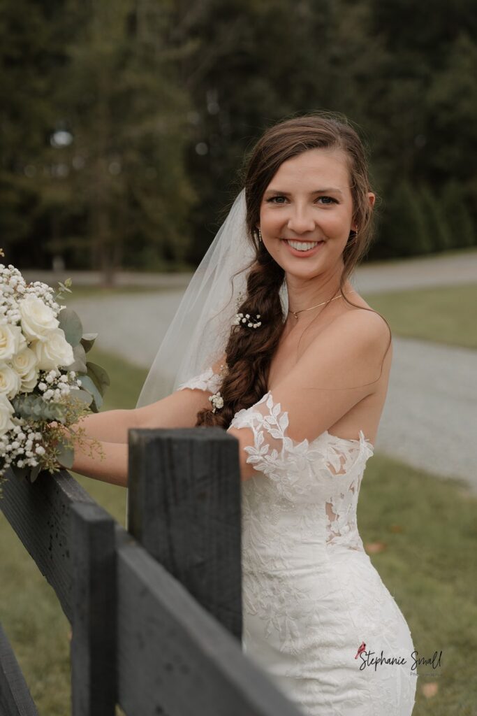 Bride and groom portrait in open field at Oakland Farms wedding venue in Sanford North Carolina